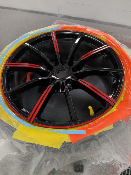 Custom wheel painting — black with red accent lines