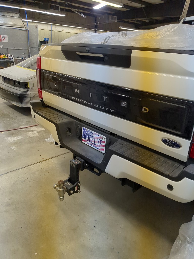 Rear of F-450 in shop with tailgate panel installed