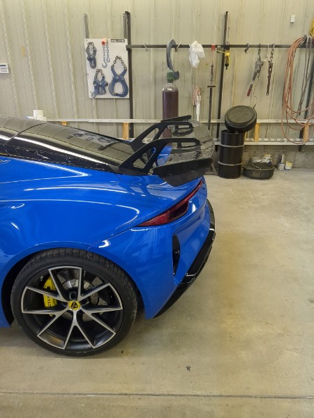 Custom wing mounted on Lotus Emira in the shop